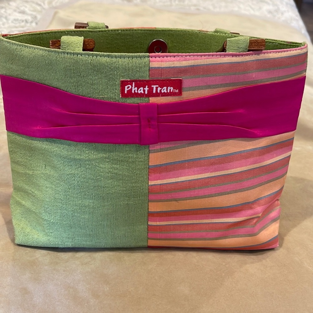 Phat Tran green and pink small handbag with wood handles and a  snap closure